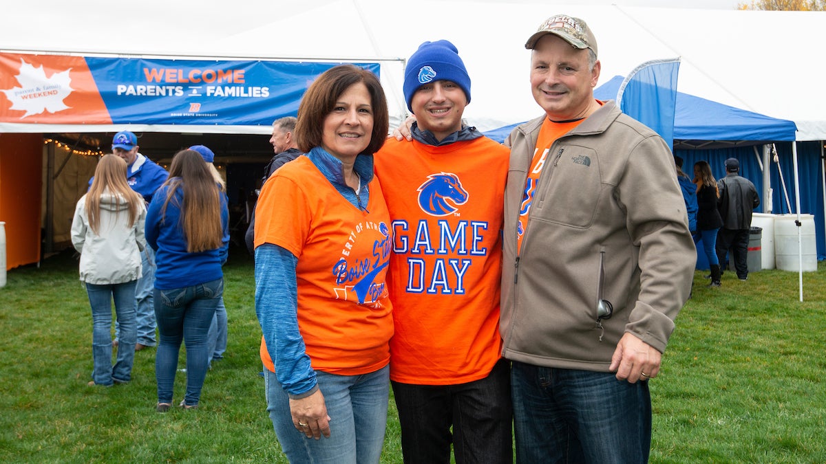 Photo of three family members together during the Boise State Parent and Family Weekend in 2018.