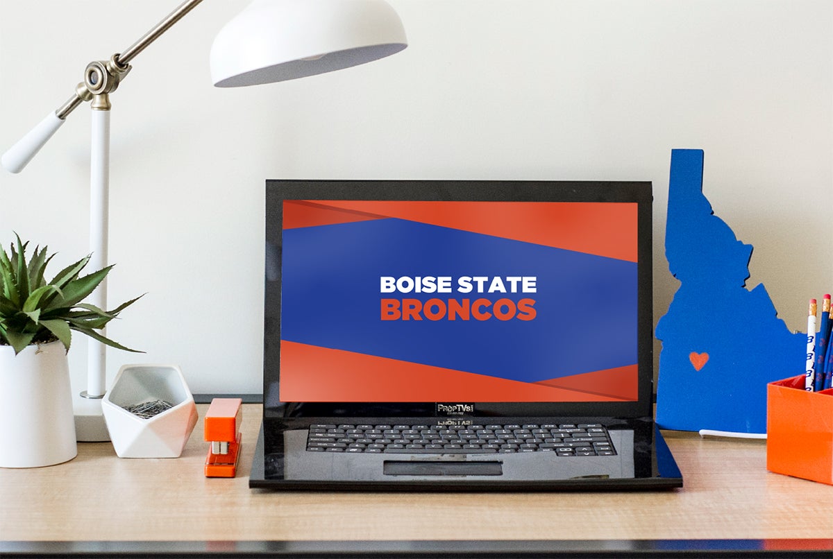 A laptop proudly displays a Boise State Broncos computer wallpaper