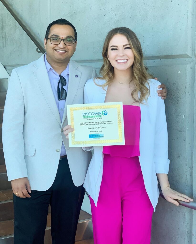 Sierra and Engineering professor Dr. Krishna Pakala stand holding an award at Discover Engineers Week.