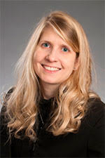 white woman with blonde hair wearing a black shirt