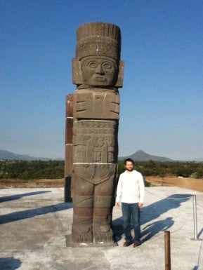 David Christensen standing near totem