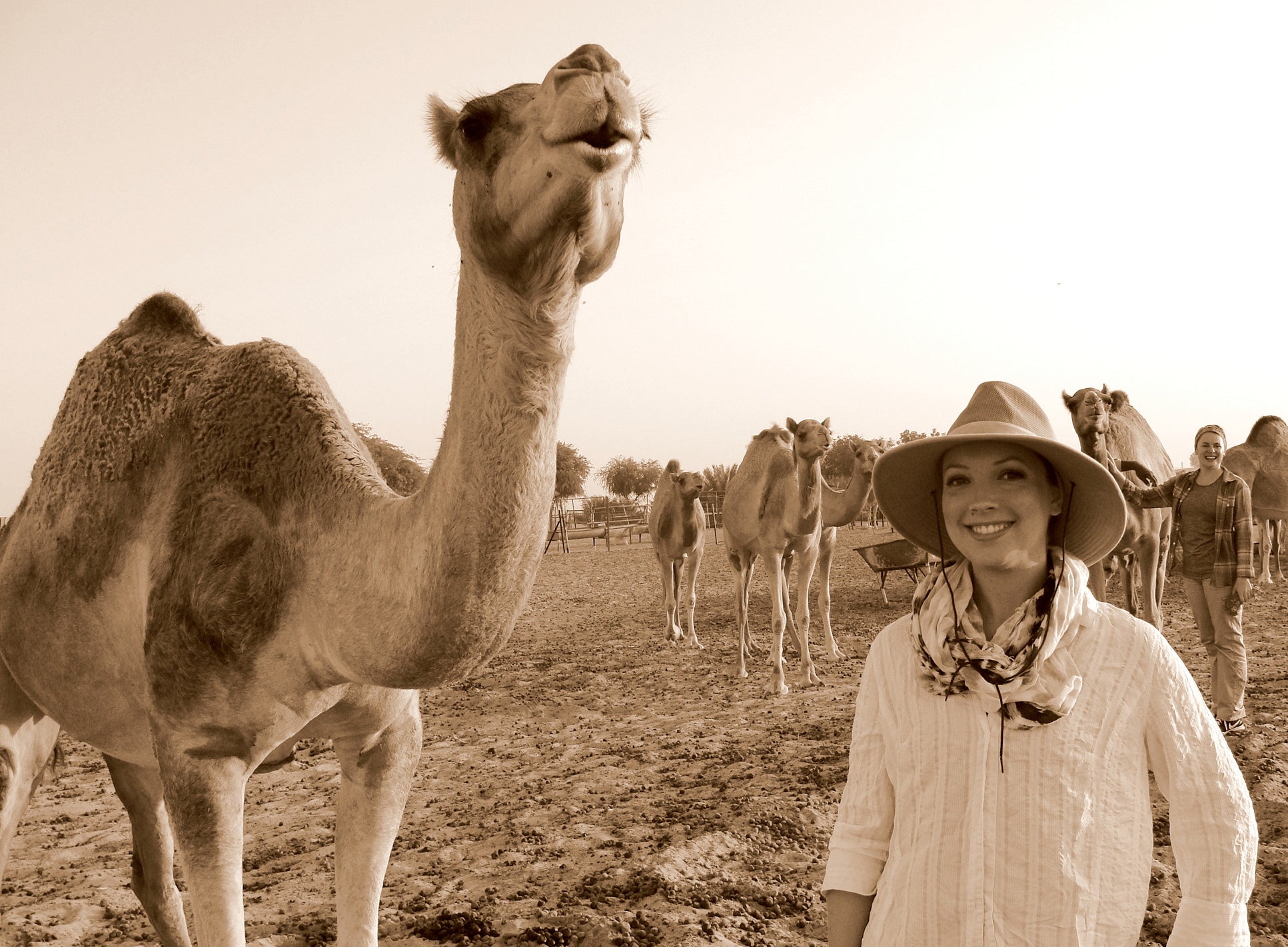 Margaret Amundson standing next to a camel