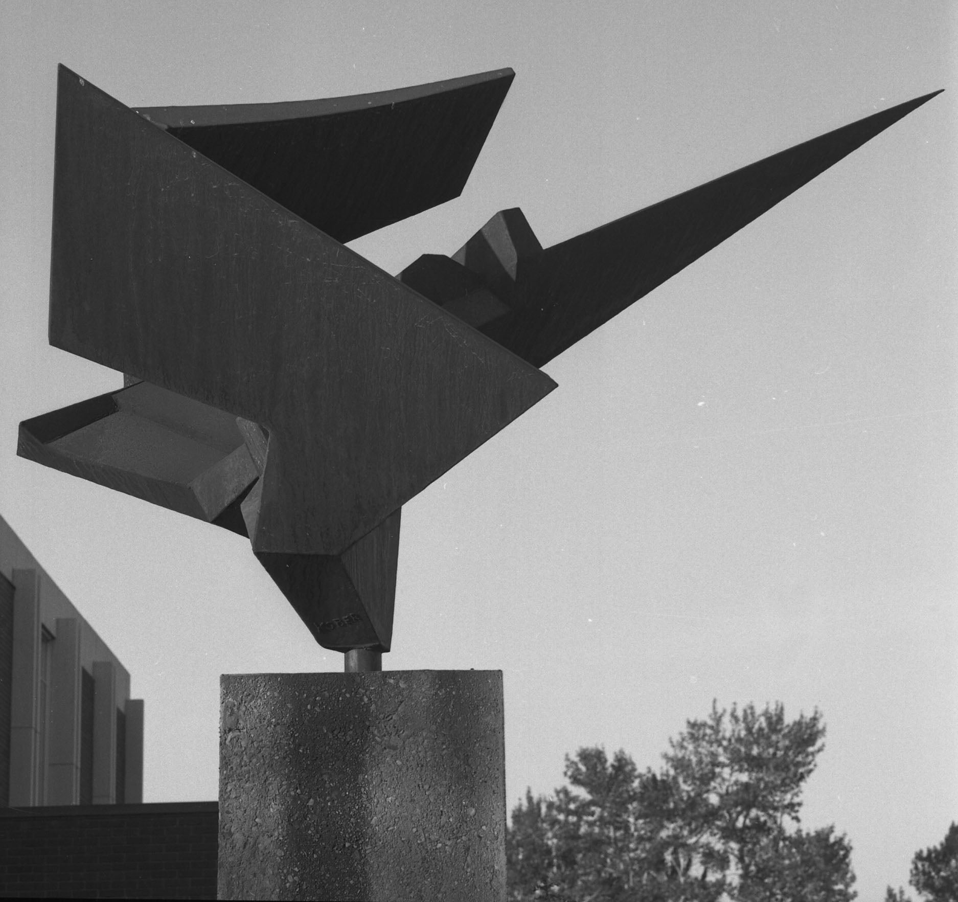 Metal sculpture designed to look like a bird in flight