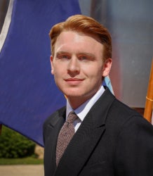 student headshot in a suit