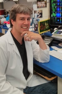 Matthew Ferguson posing in a lab