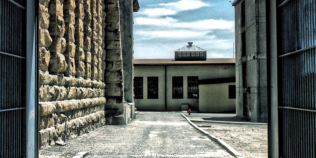 Penitentiary buildings viewed through open gates