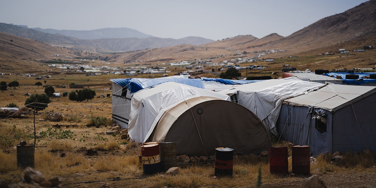 makeshift tents on a hillside