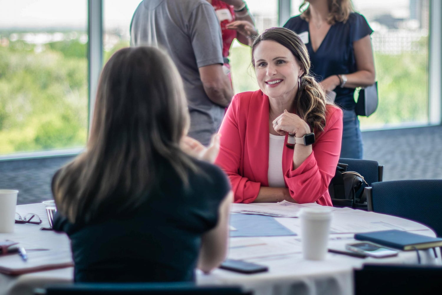 Employer talking with a student at a table in the Stueckle Sky Center