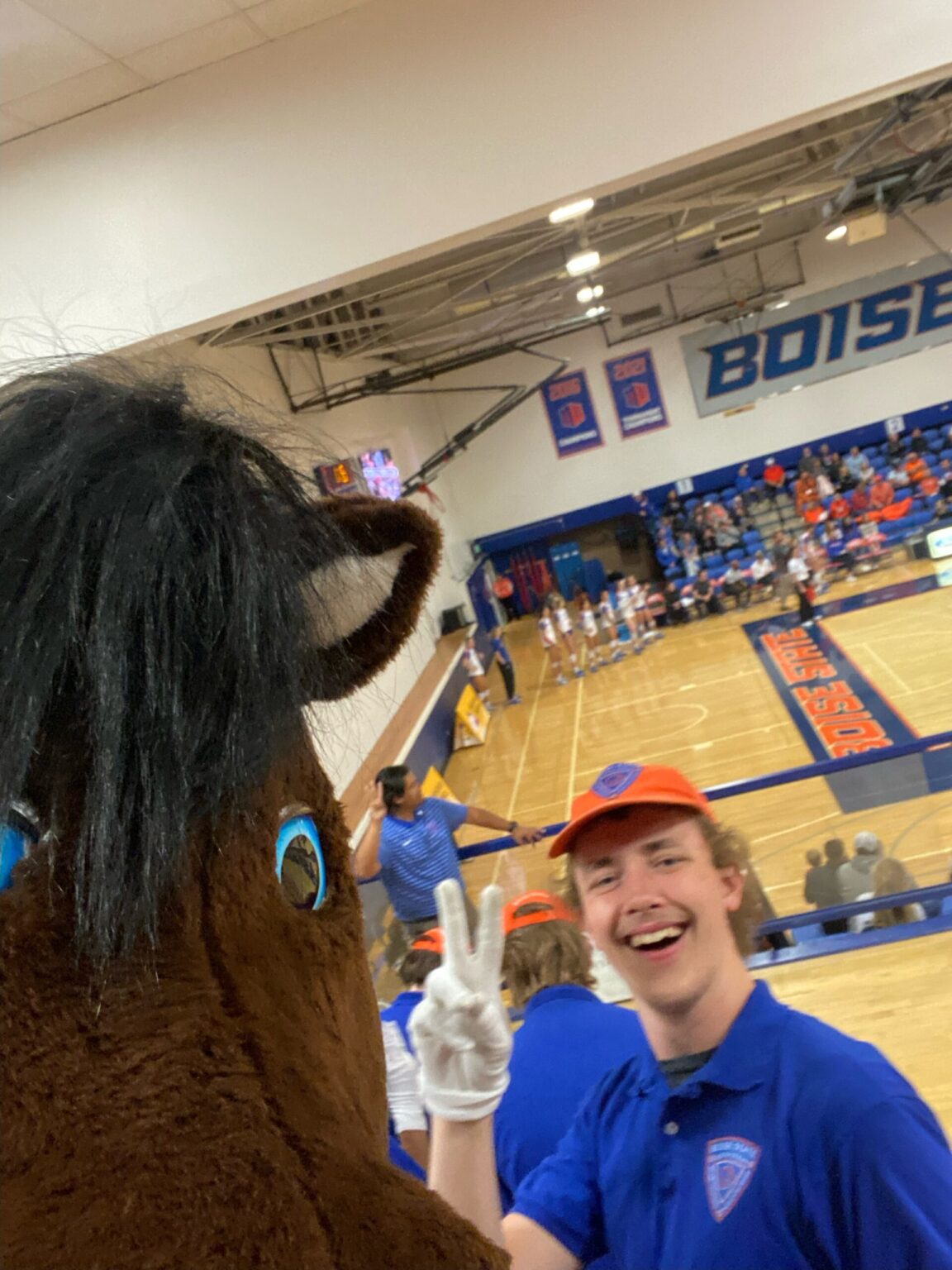 Seamus Jude behind Buster Bronco in the Boise State Gym