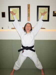 Photo of Bevin Daglen wearing a Judo gi with a black belt