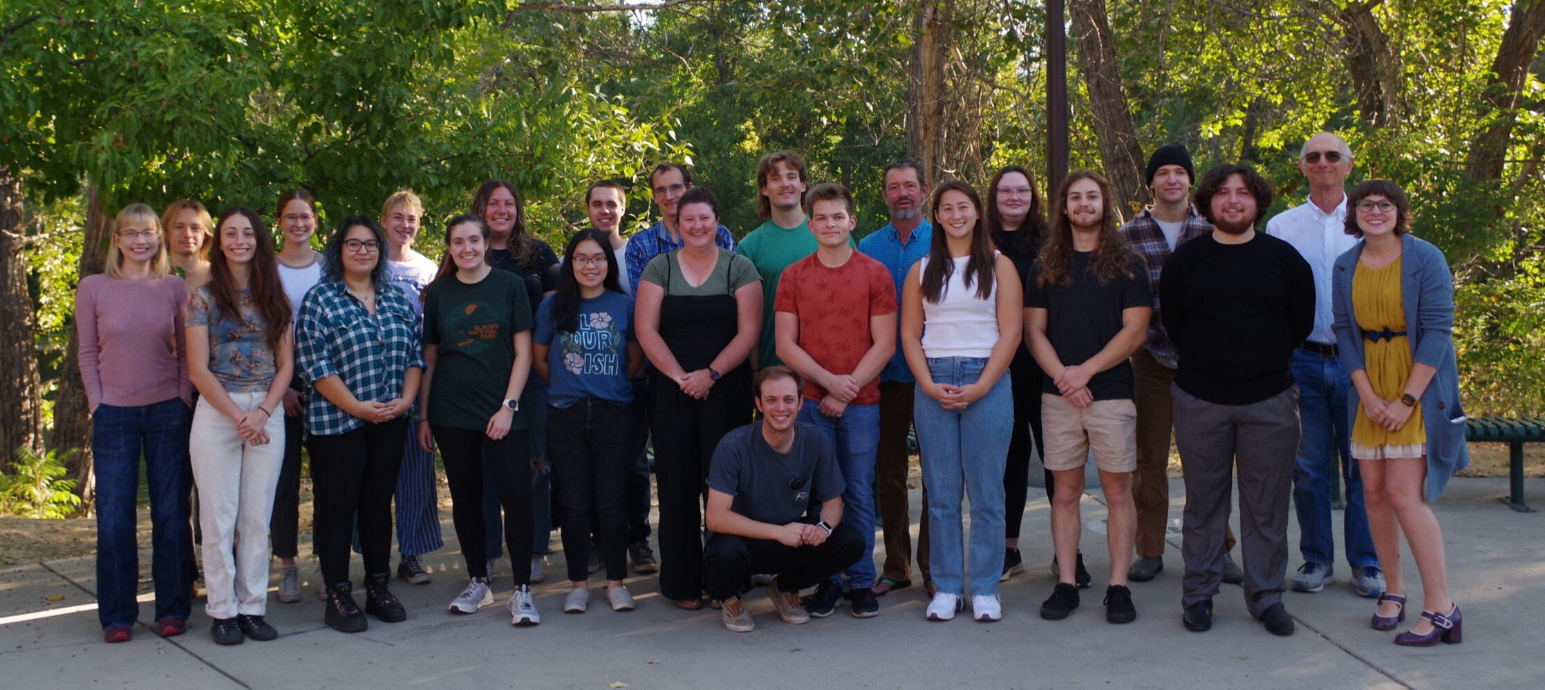 Group photo of Chemistry Instructional Center team, outside with trees in the background