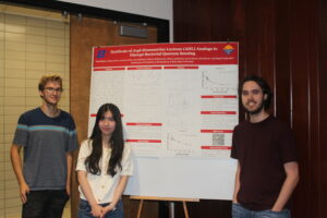 Photo of 3 people standing in front of a Project SEED research poster