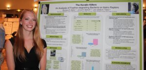 picture of undergrad researcher and poster