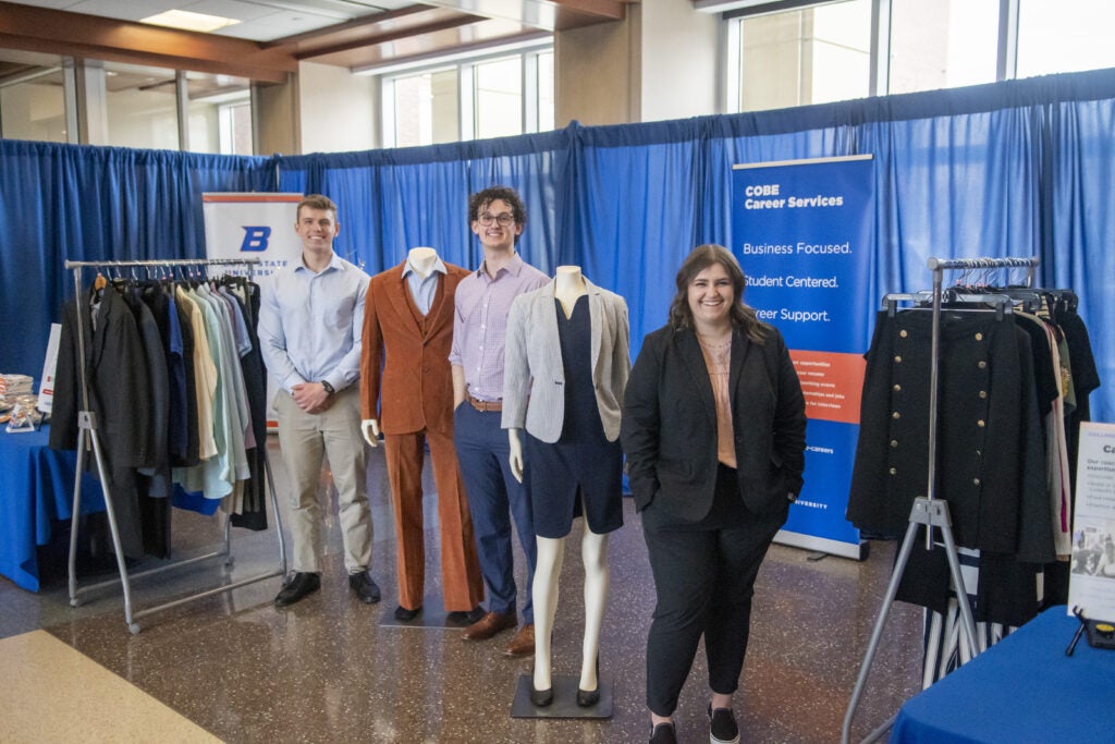 Students and mannequins dressed in business casual attire