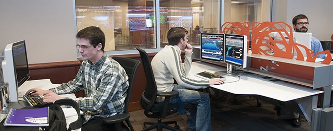 student using Bloomberg financial terminals