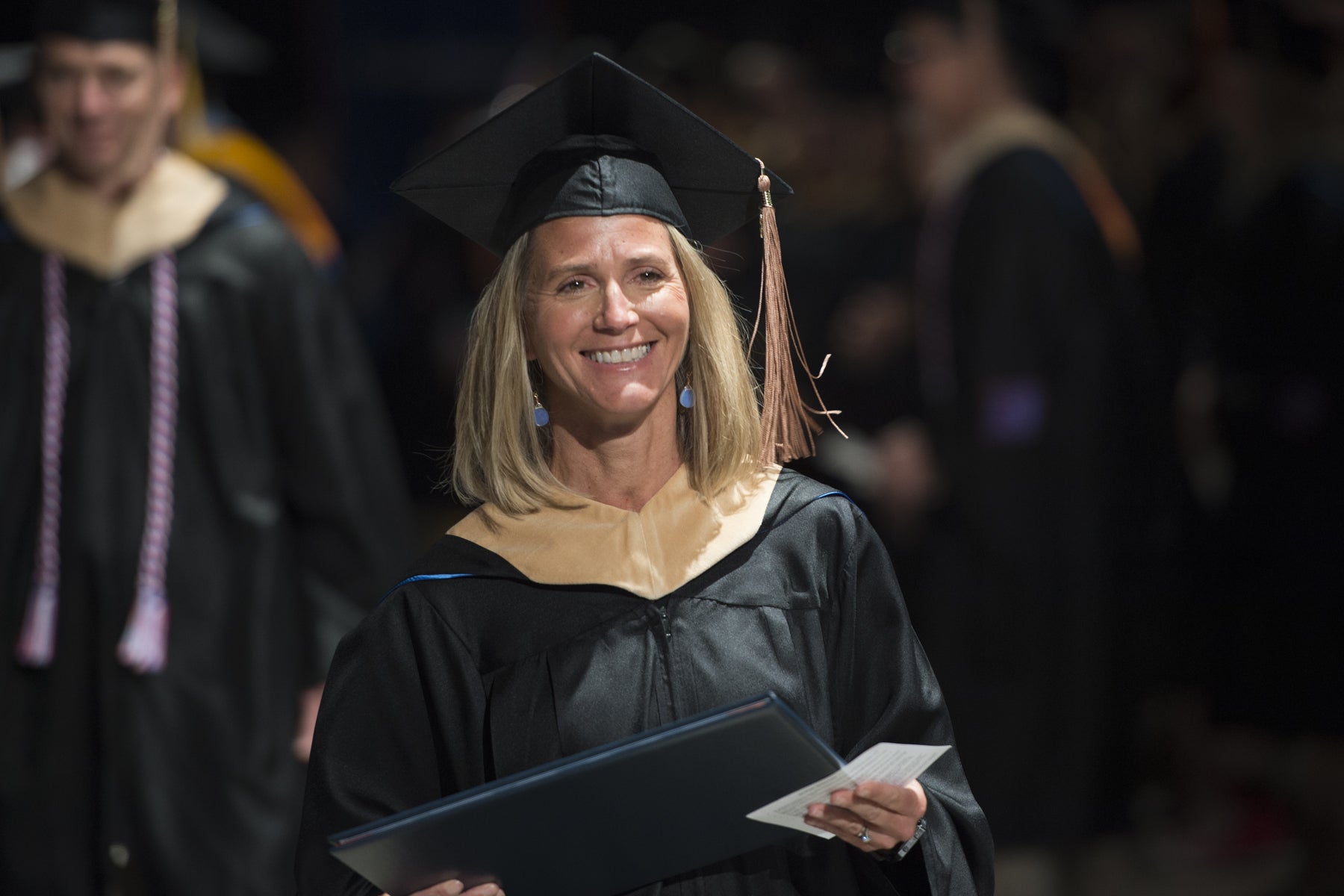 MBA student receiving diploma at commencement