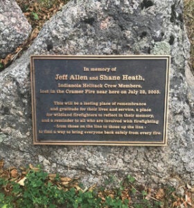 Memorial plaque for Jeff Allen and Shane Heath hung on a large rock