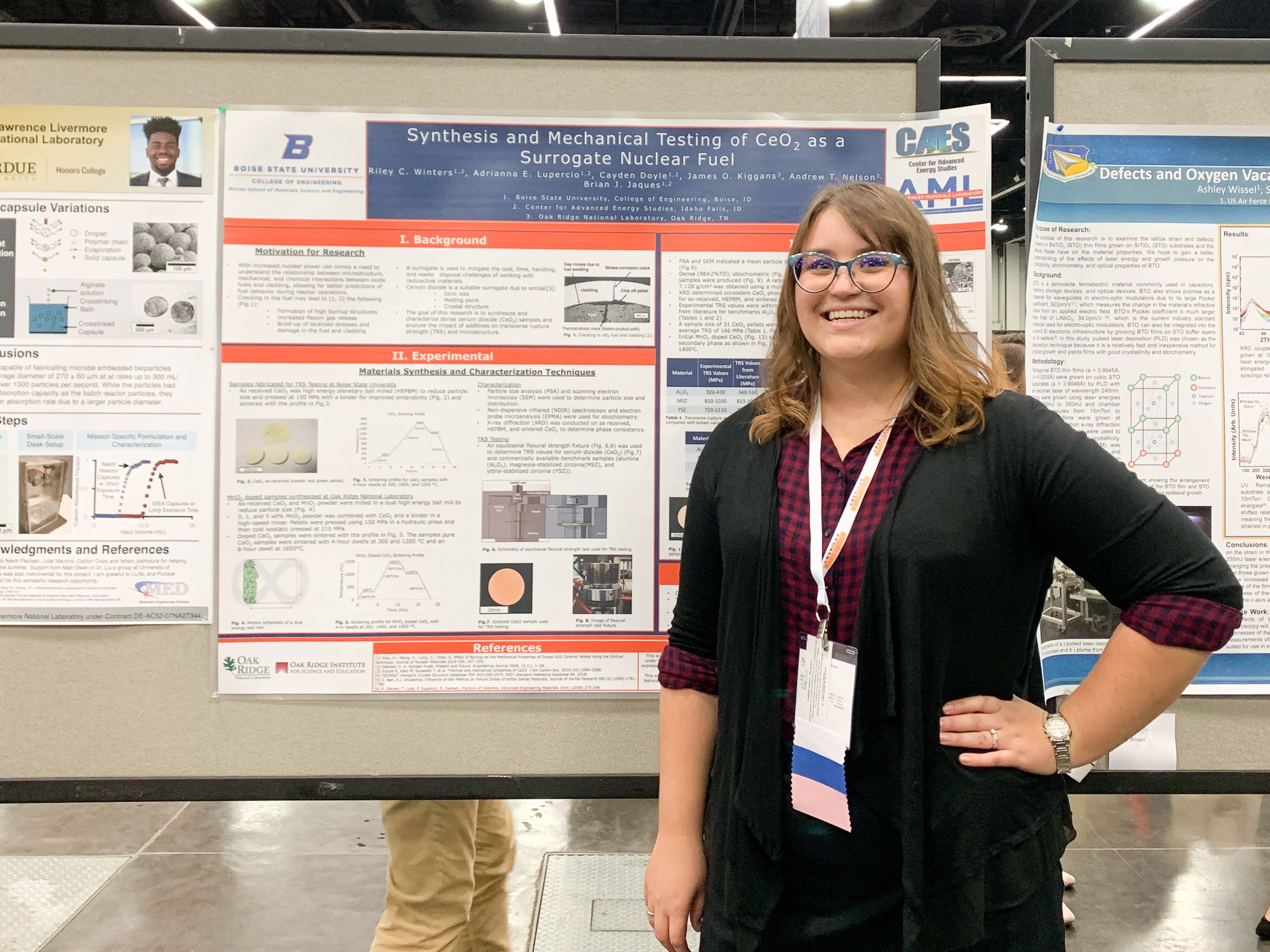 Riley Winters standing in front of a research poster