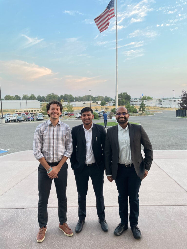 Three students standing together