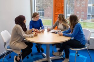 Four women in table talking