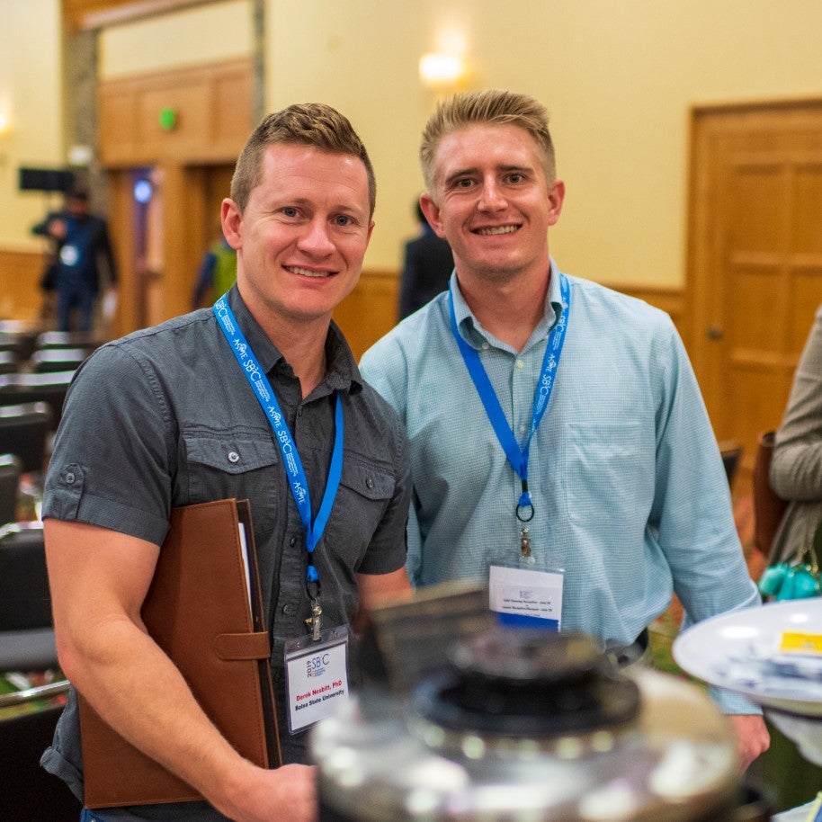 2 male students at a conference