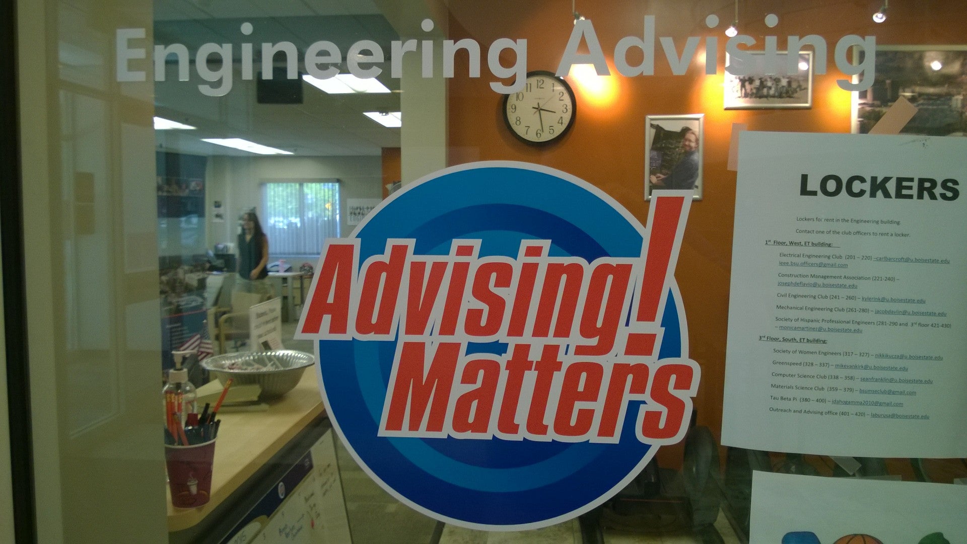 glass window of COEN Advising office with Engineering Matters! decal