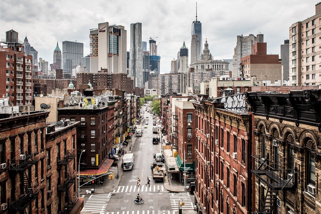 older buildings along a road leading into a cityscape