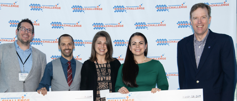 Students holding a giant check