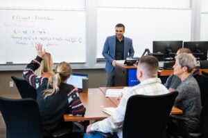 A meeting with five faculty members.