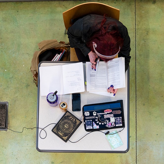 Student studying at a table, Boise State photo