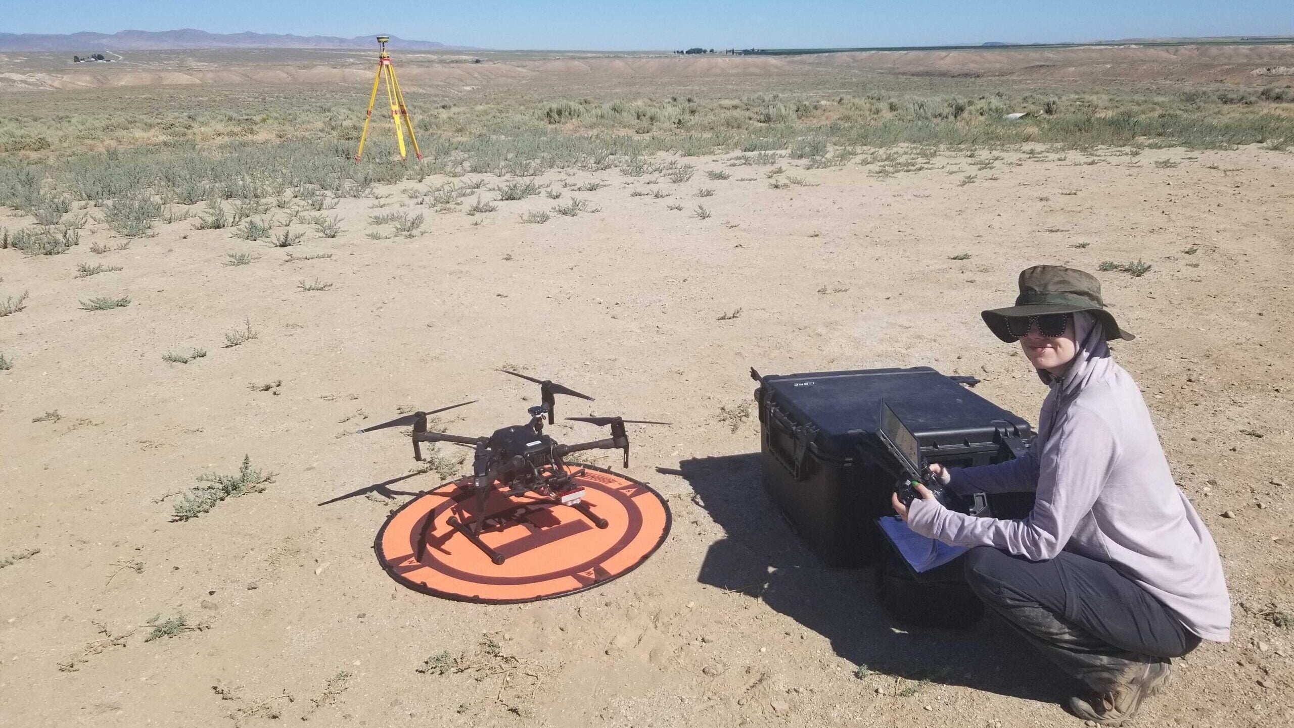 Photo of TRIO STEM student Valorie Marie in a field with a drone