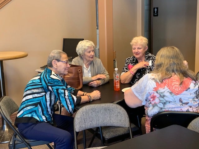 People gather to visit with friends and enjoy refreshments at the Emeriti Guild Fall Social 2019