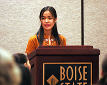 Student speaking at a podium