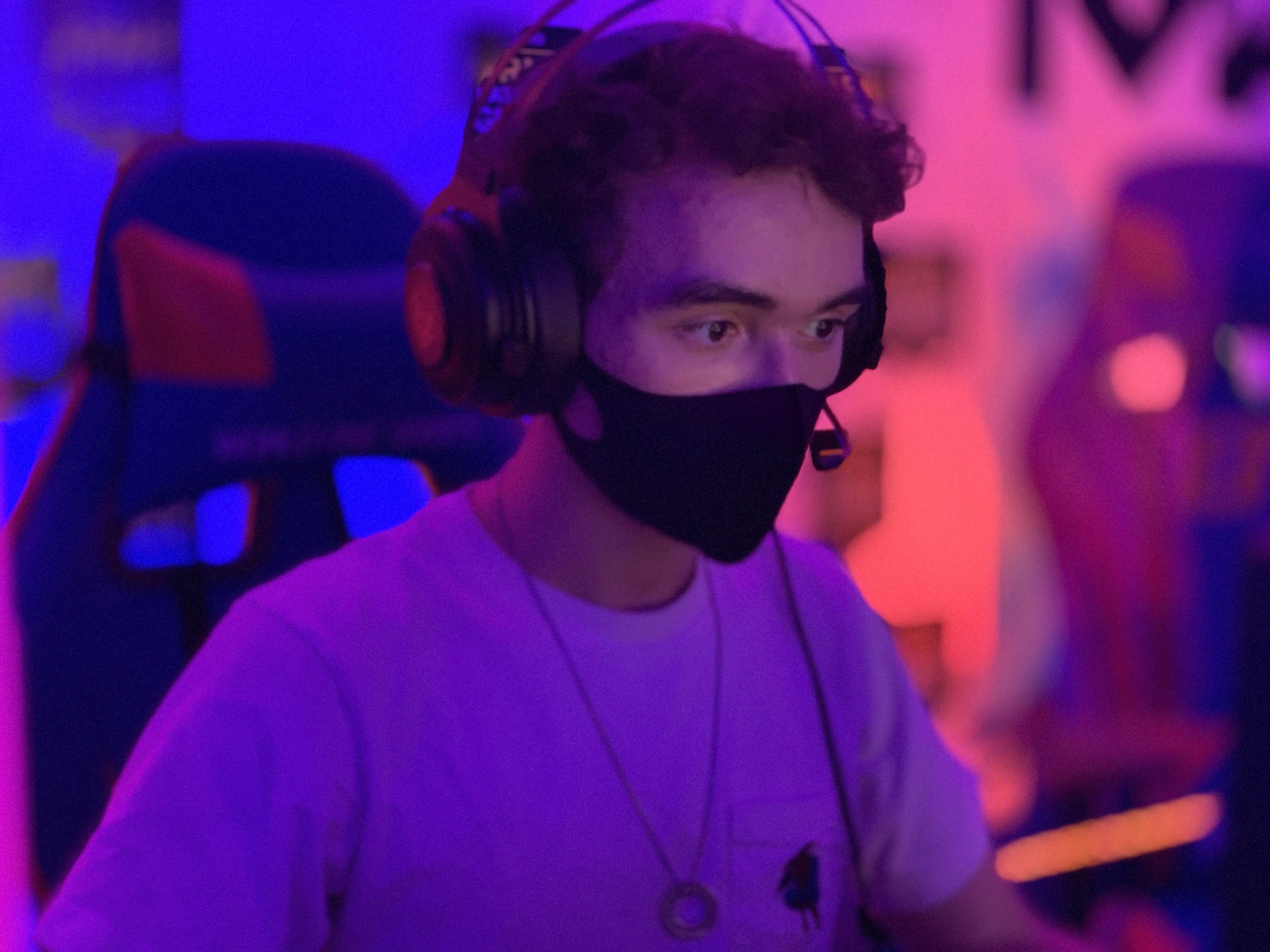 gamer wearing a headset and face mask