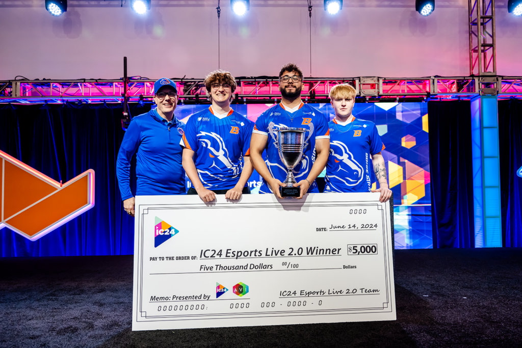 Photo of the Boise State Rocket League team posing with a trophy.