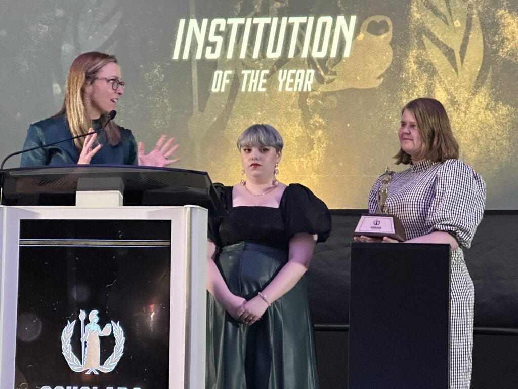 Picture of Dr. Amanda Ryan (left), Rae Barnes (middle), and Jenny Cummins (right) representing Boise State Esports at the Scholars Awards.