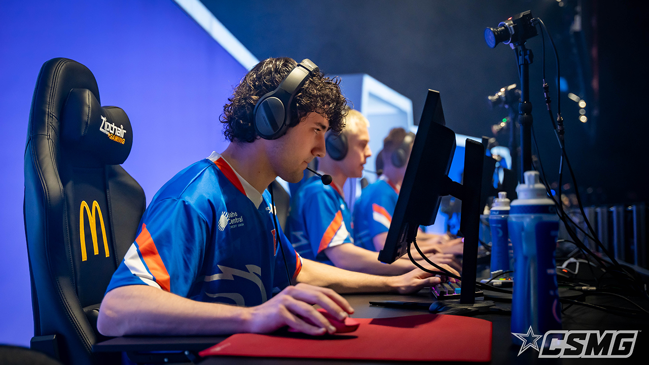 Photo of Ian Perfit sitting at a desk competeing at the CECC esports tournament.