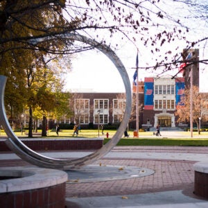 Sculpture in the quad with the Boise State Administration Building in the background