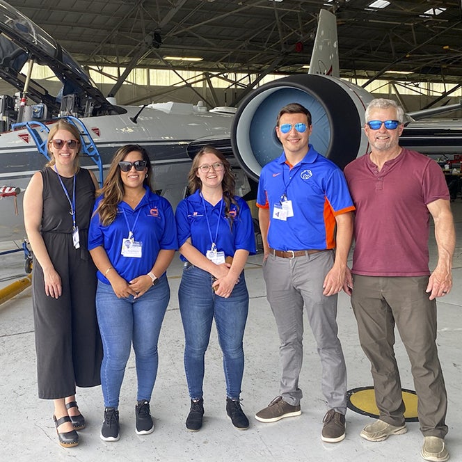 From the left, mentor Megan Gambs, DeAnna Andrade, Ainsley Iwersen, Soren Witter, and Distinguished Educator in Residence and retired astronaut Steve Swanson at the Johnson Space Center.