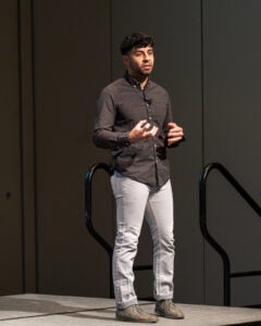 Adrian Rodriguez presenting on stage