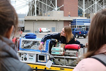 Student demonstrating equipment in the parking lot west of Albertsons Stadium. 