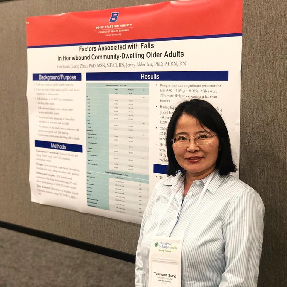 Lucy Zhao with research poster at conference 