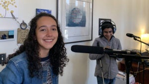 Two students doing voice recordings