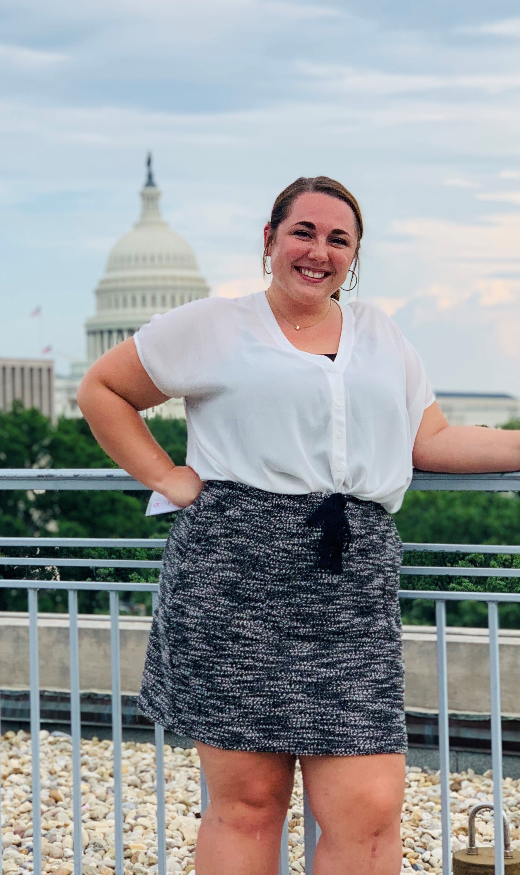 Josie Bryan poses for a photo in front of the capitol building.