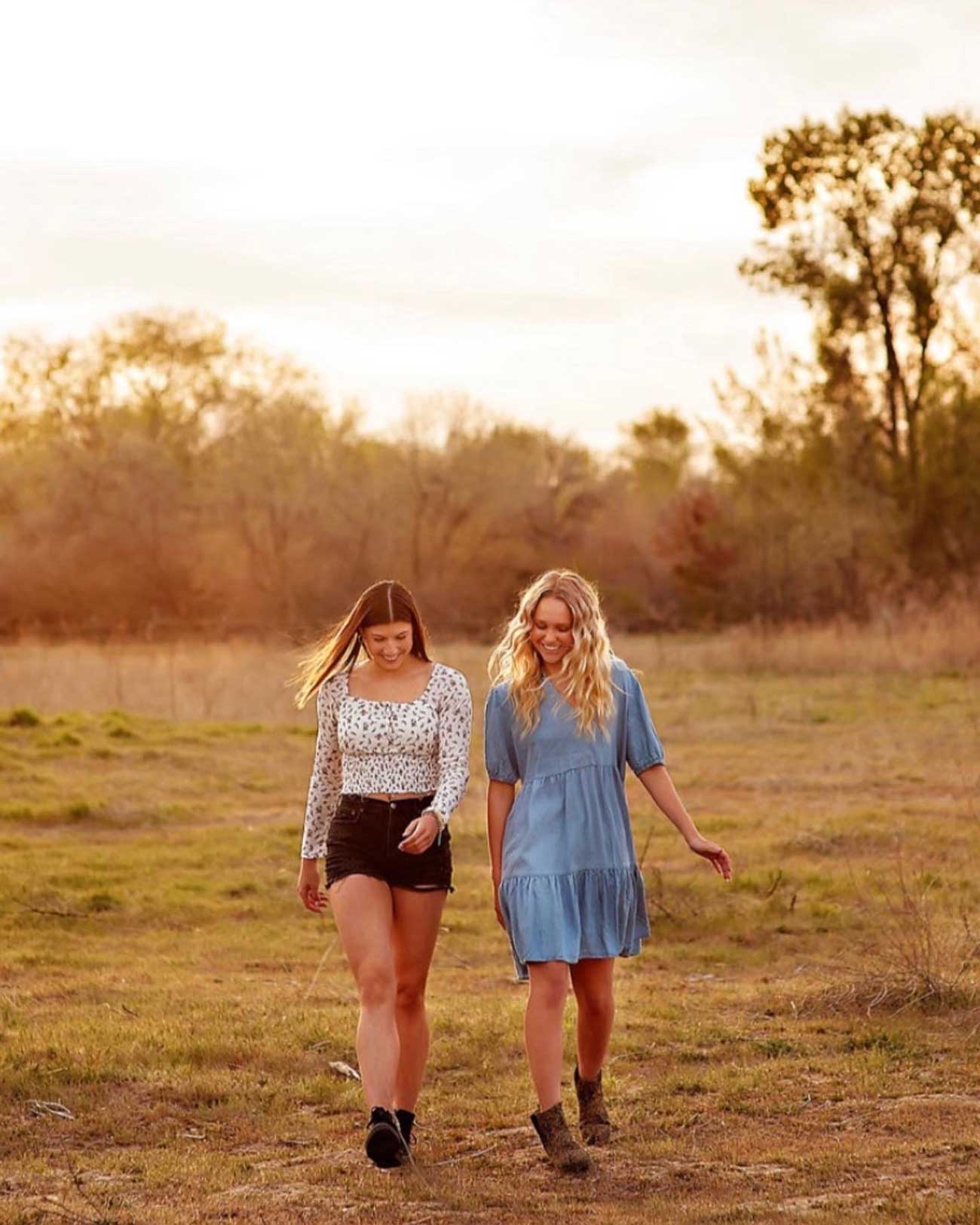 Baylee Sanderson walks with her friend Hailey at sunset