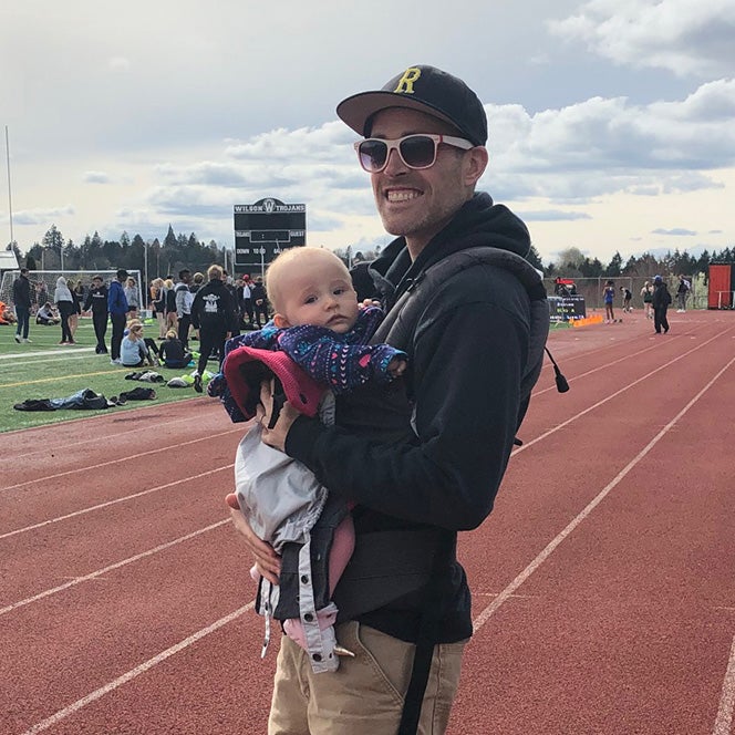Jake Stout with his child on a track