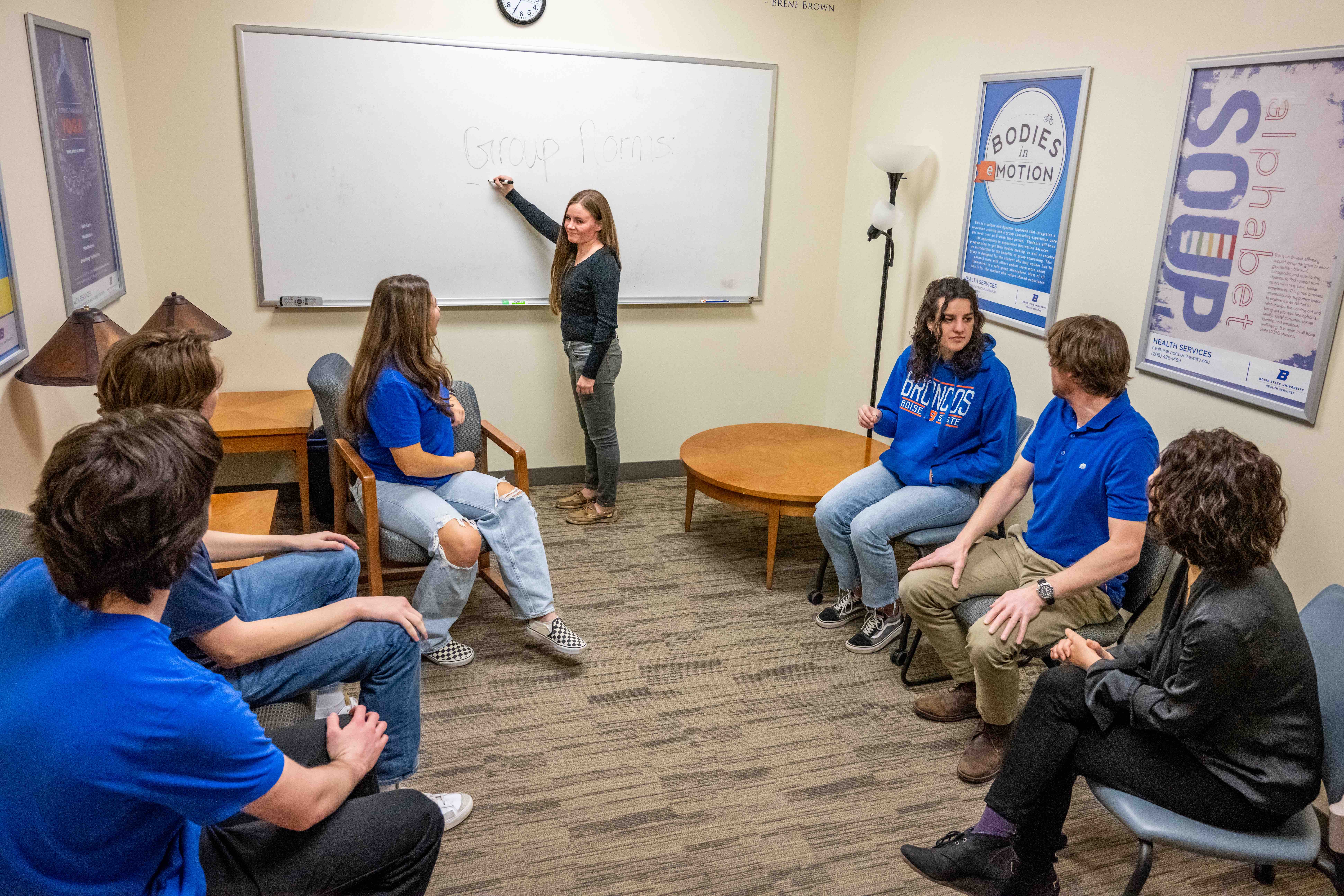 Boise State students in a group counseling session with a licensed facilitator.
