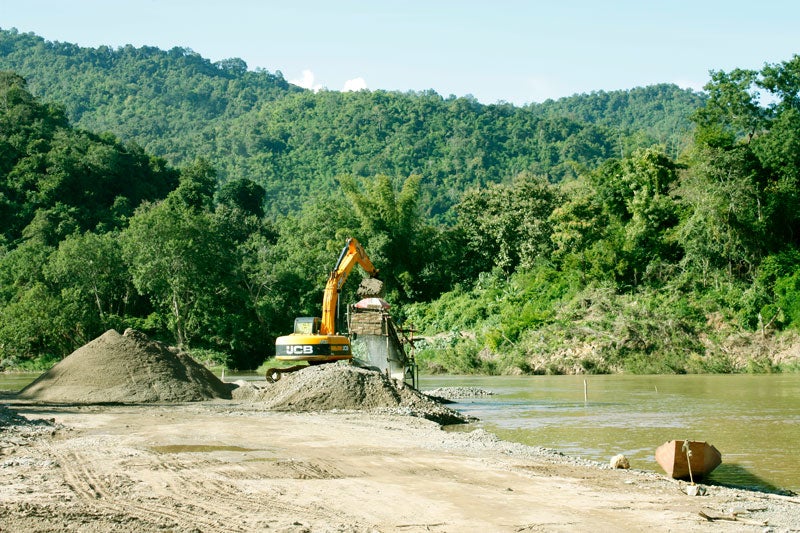 Backhoe loading sand