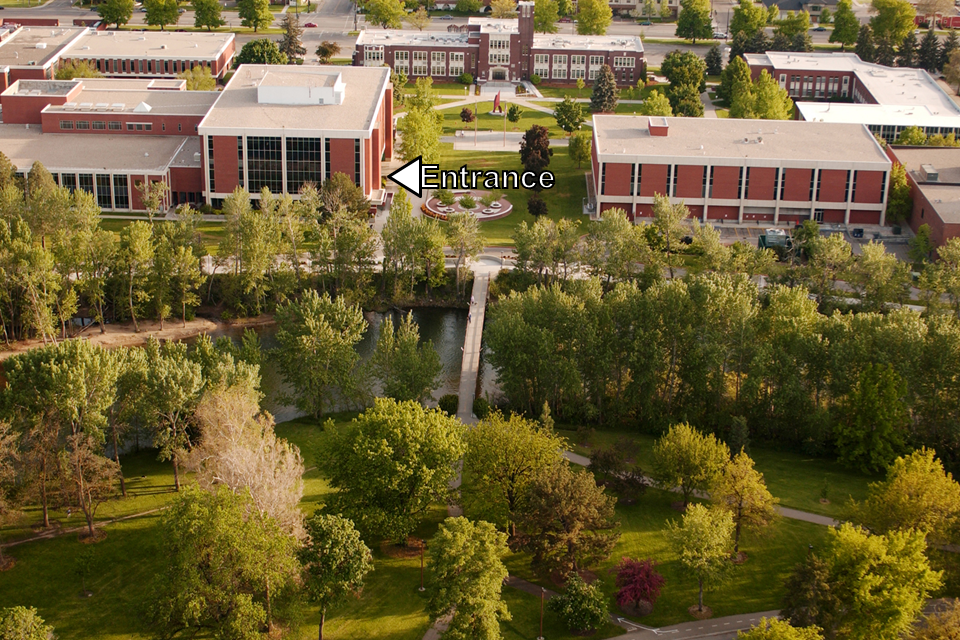aerial view of campus with arrow pointing to enterance
