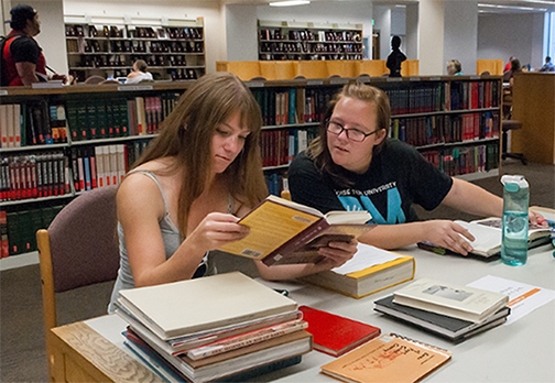 Students going through books together